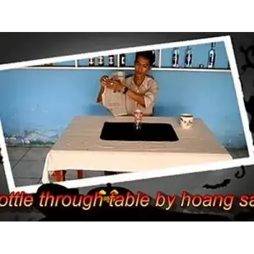 Bottle Through Table by Hoang Sam